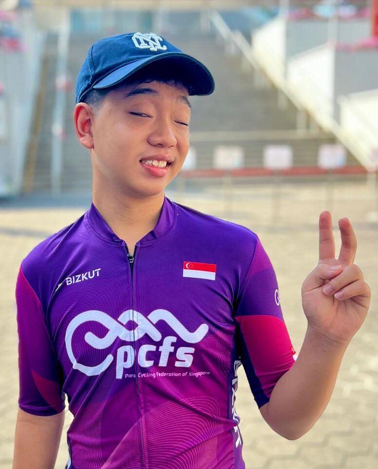 Community Athlete - Evan Posting for a Photo outside National Stadium